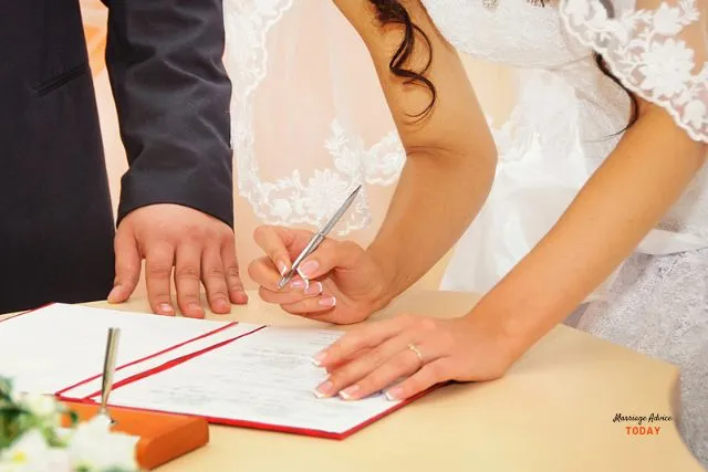 bride and groom signing marriage certificate- understanding difference between marriage license and certificate.